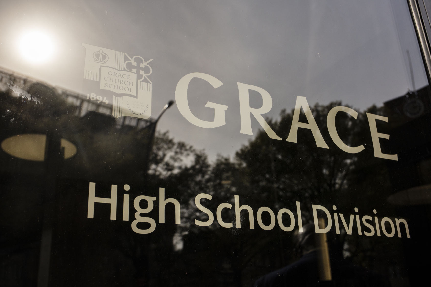 A sign on a window of Grace Church School.